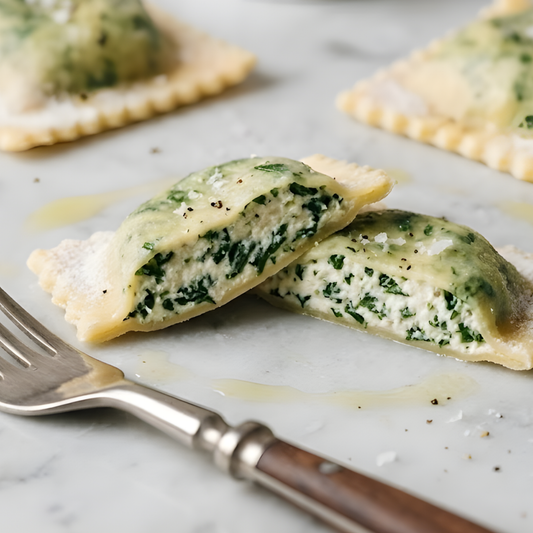 Spinach and ricotta-filled pasta parcels on a marble surface with a fork.